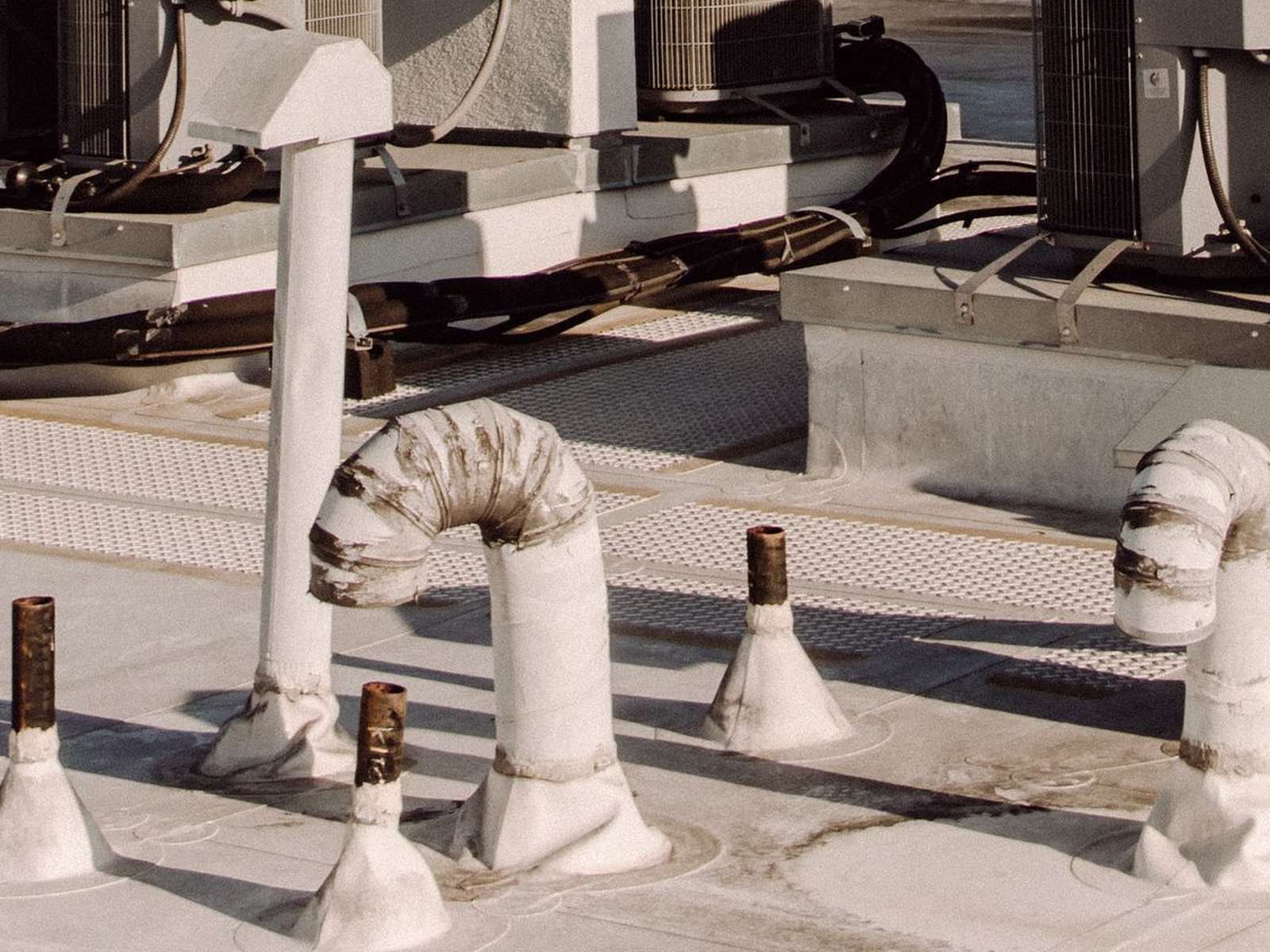 Rooftop condensing units on a flat commercial roof