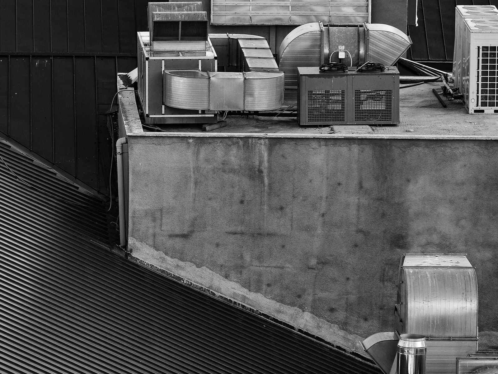 Mechanical equipment on a commercial rooftop, black and white