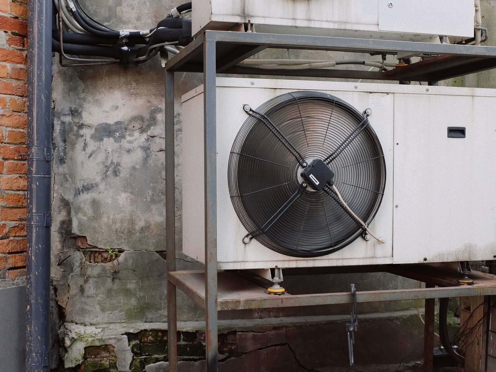 Outdoor condensing unit with fan on a steel stand