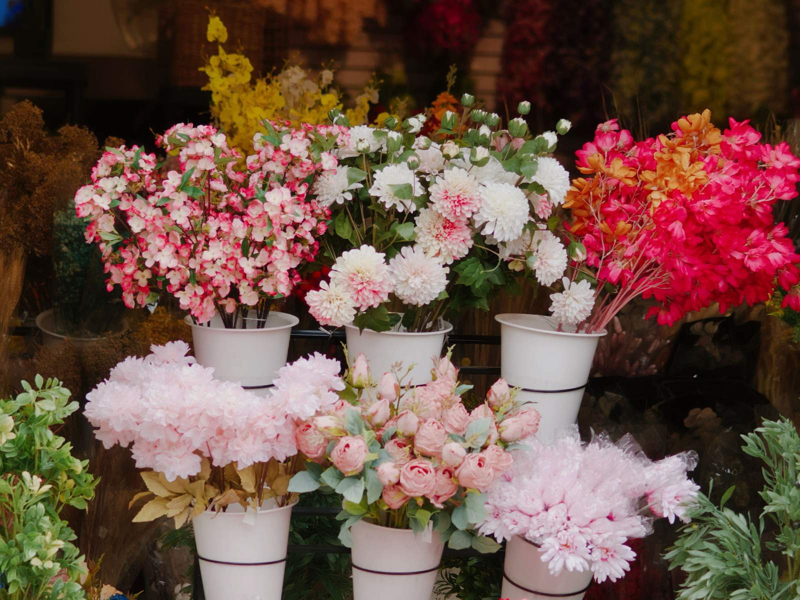 Buckets of fresh cut flowers in a florist shop