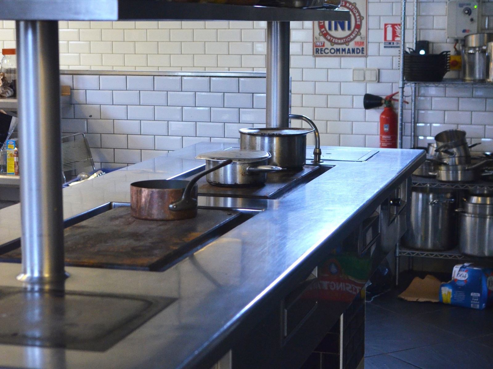 Stainless steel prep counter in a commercial kitchen
