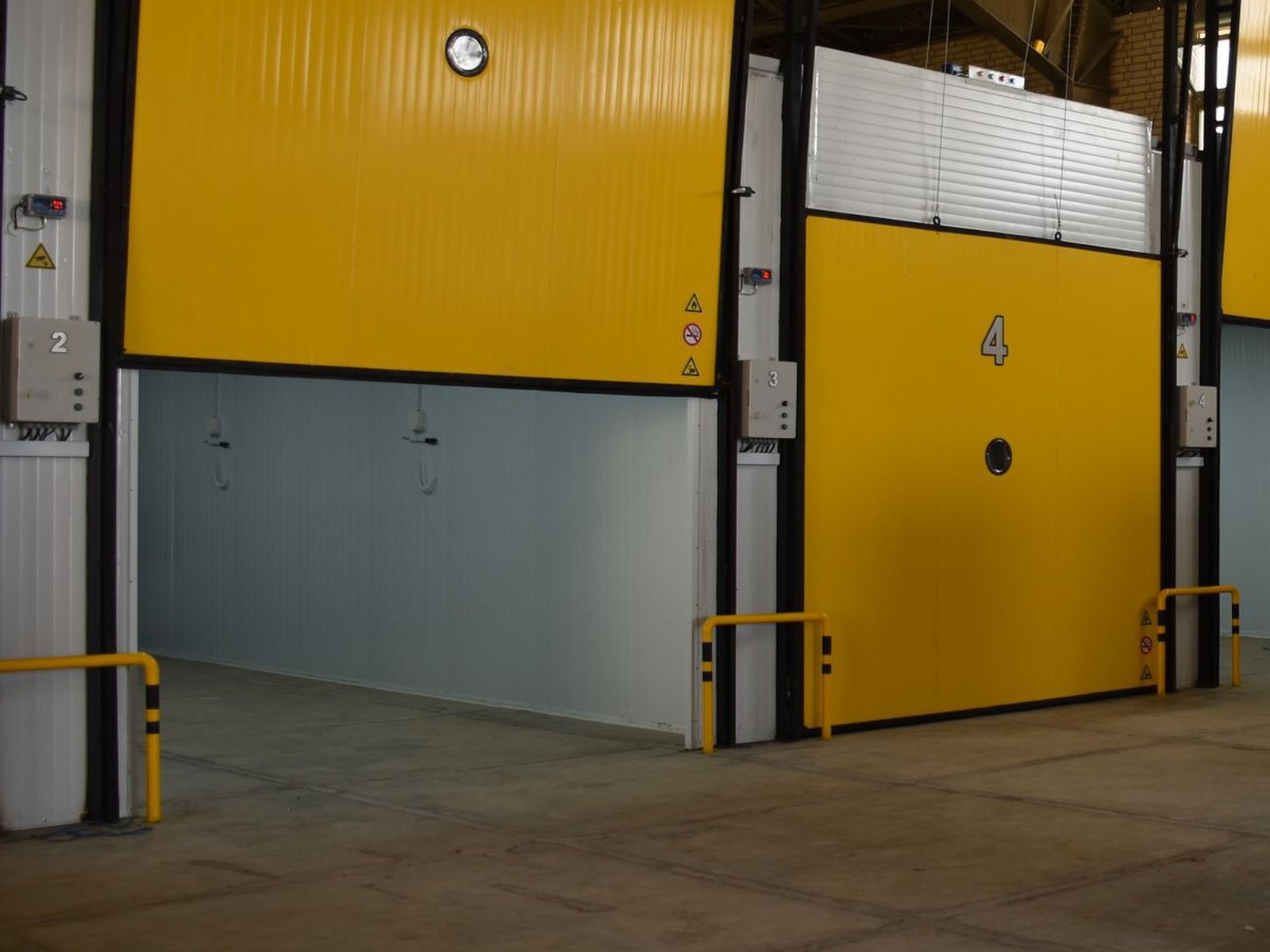 Insulated cold room doors inside a refrigerated warehouse